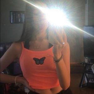 cropped neon orange tank top with blue butterfly